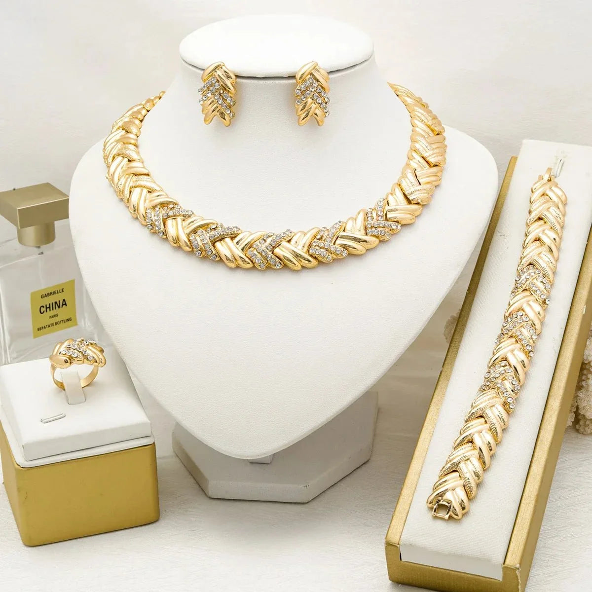 Women's Dubai 18K gold plated luxury jewelry set featuring intricate necklace and earring designs by TrendLux Wear.