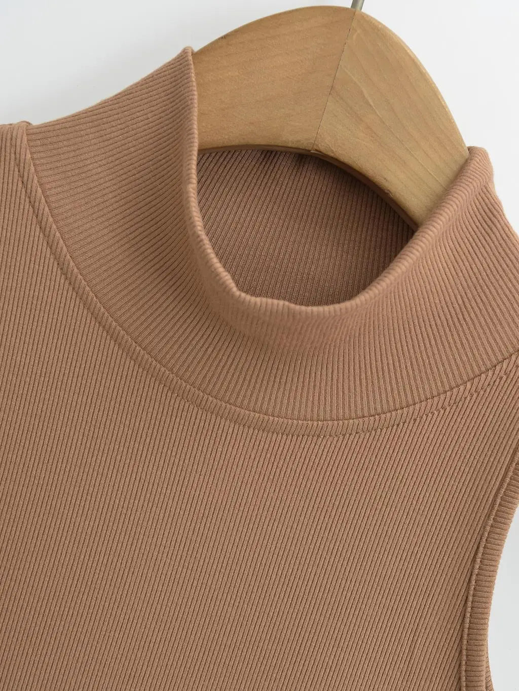 Women's knit turtleneck bodycon maxi dress by The Glow Sanctuary, featuring a fitted silhouette and ankle-length design.