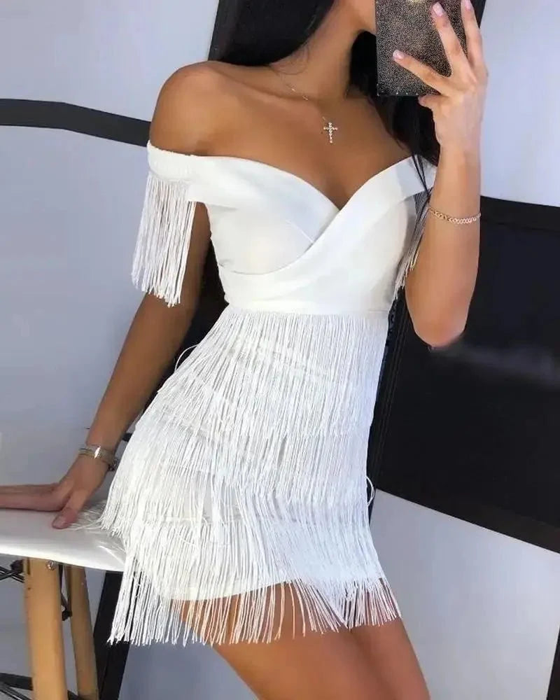 Black fringed one-shoulder mini dress from The Glow Sanctuary, perfect for a night out, featuring stylish fringed detailing and a fitted silhouette.