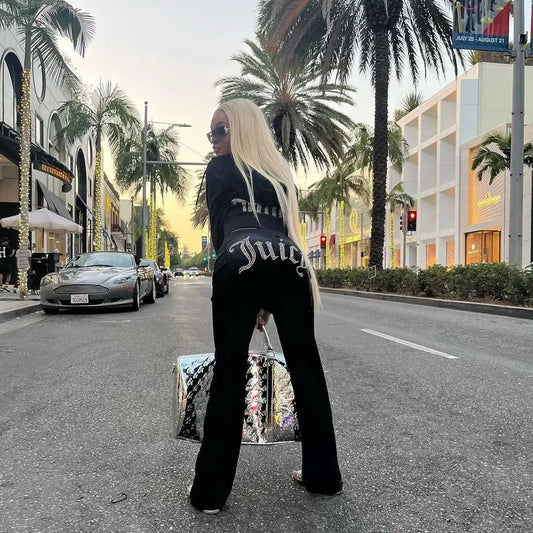Women's Y2K style two-piece hooded tracksuit by TrendLux Wear with long-sleeve jacket and flare jogger pants, available in S–XL.