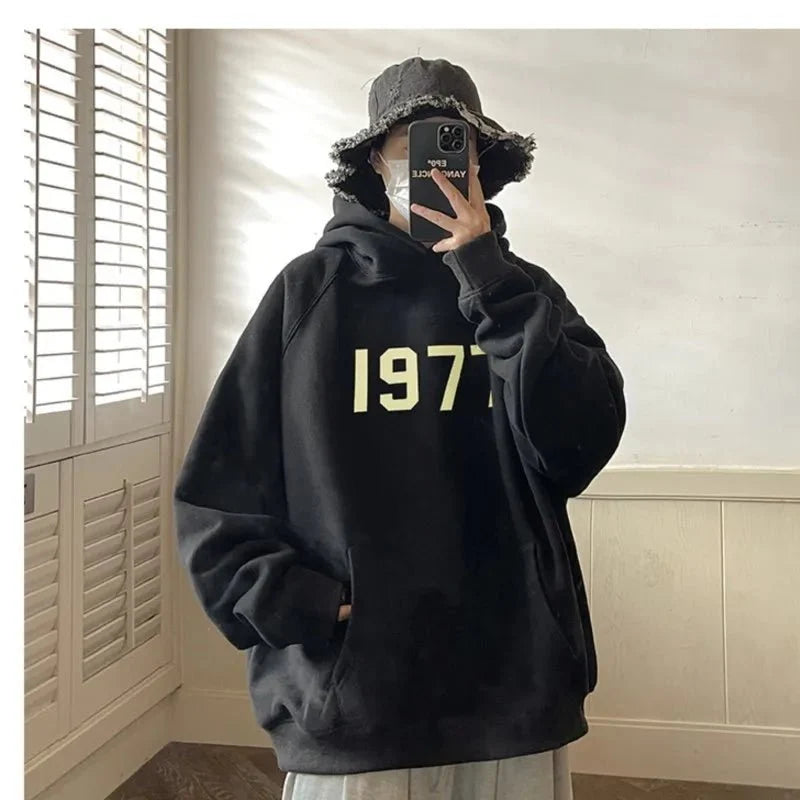 Men's TrendLux Wear printed Harajuku hoodie, loose fit long sleeve sweatshirt with 1977 design in black and white.