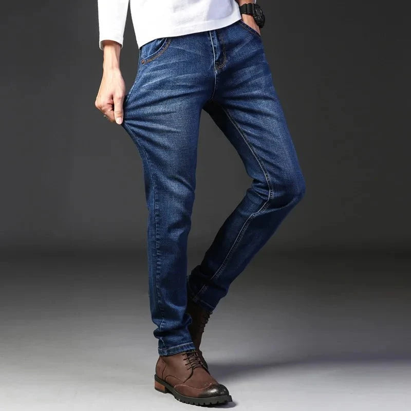 Men's elastic straight leg jeans by TrendLux Wear in classic blue and black, casual work denim, available in sizes 28 to 40.
