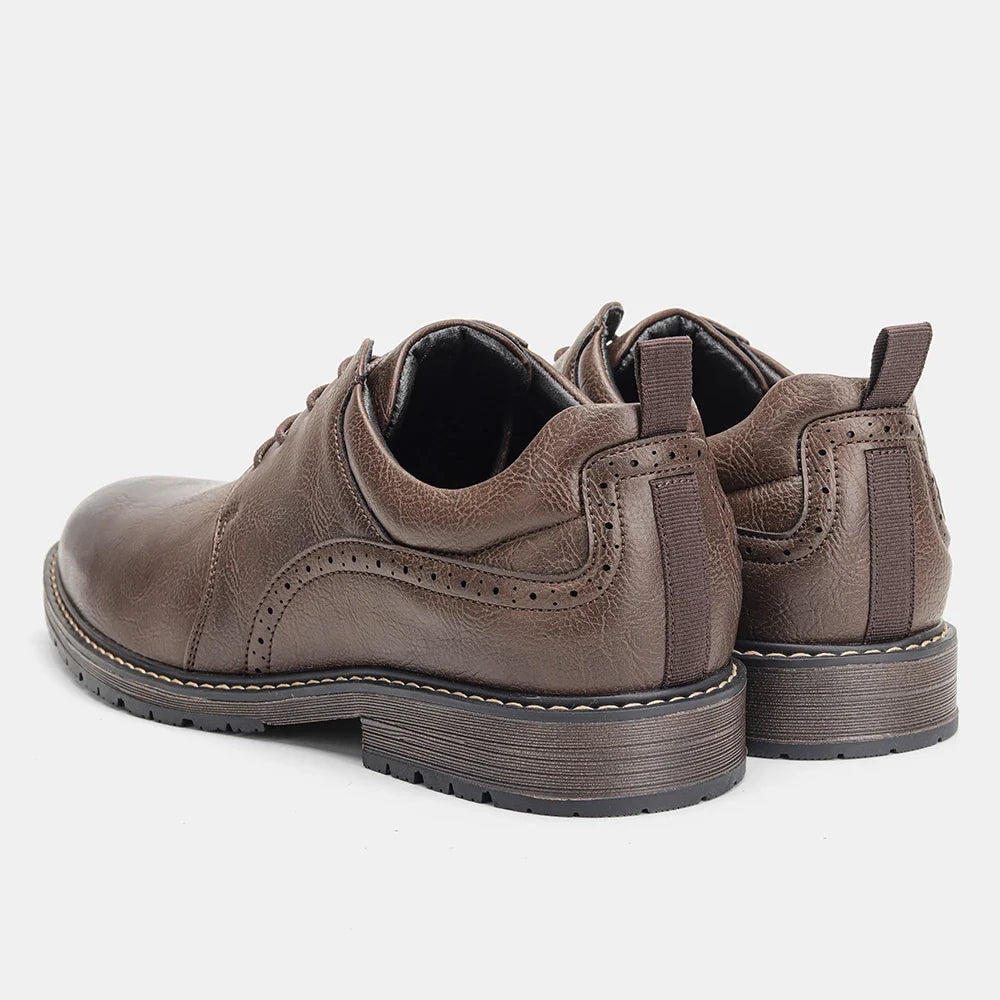 Brown leather Derby shoes with round toe, lace-up closure, and rubber sole. Features decorative stitching.