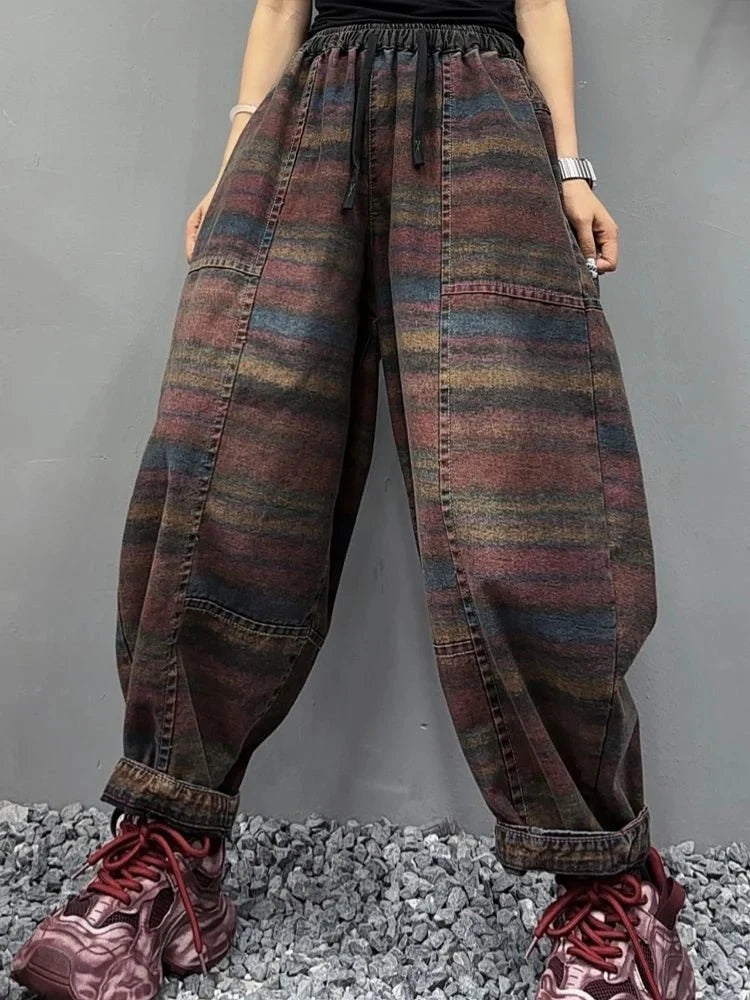 Women's Korean style striped harem jeans with loose elastic waist, denim trousers from TrendLux Wear, relaxed fit and trendy design.