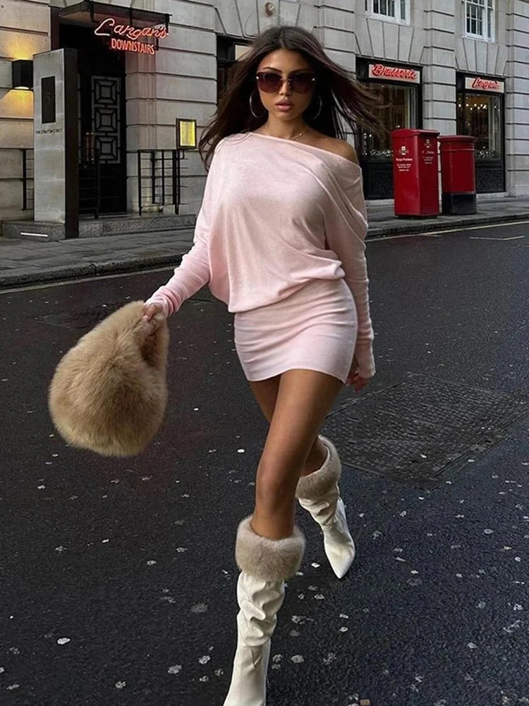 Women's off shoulder bodycon mini dress with long sleeves and oblique neckline, stylish party dress by TrendLux Wear for fall and winter.