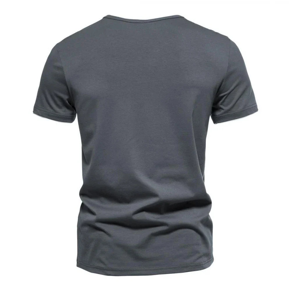 Men's slim fit Henley T-shirt by TrendLux Wear, breathable and moisture-wicking in black, white, or grey, available in sizes S to 3XL.