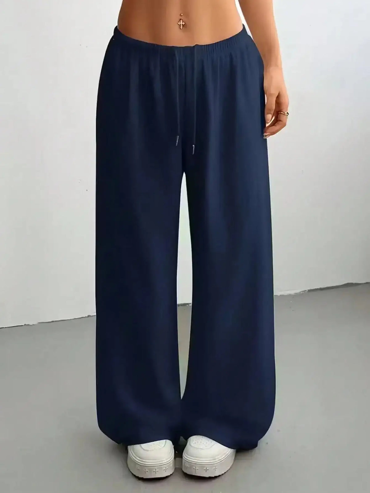 Ladies' casual wide-leg jogging pants by TrendLux Wear, shown in a relaxed fit with a comfortable waistband and stylish design.