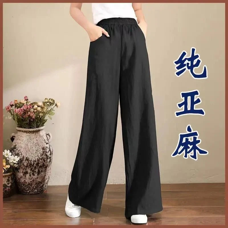 Women's linen cotton casual trousers with elastic waist and wide-leg fit from TrendLux Wear, shown in a relaxed, comfortable style.