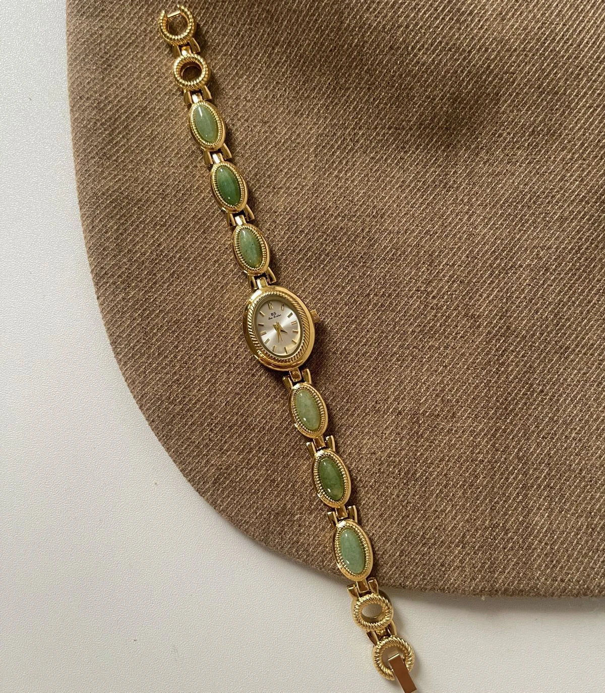 Women’s luxury jade green jewelry bracelet quartz dress wristwatch by TrendLux Wear, featuring a stylish watch with a green band and elegant face.