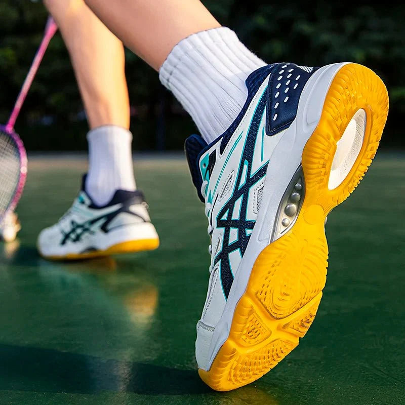 Unisex TrendLux Wear anti-slip court sneakers for badminton and table tennis with breathable athletic shoe design.