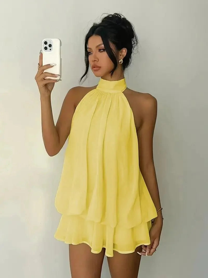 Women's backless slim-fit A-line beach dress by The Glow Sanctuary, featuring polyester fabric and a stylish, flowy design.