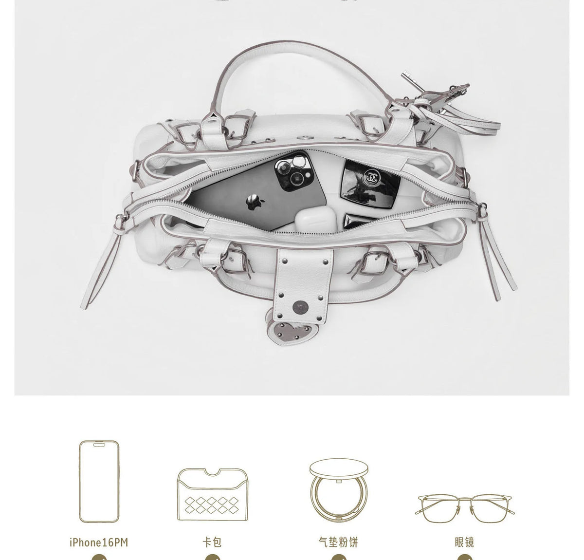 White microfiber synthetic leather handbag featuring rivet details, zipper closure, and a single crossbody strap.