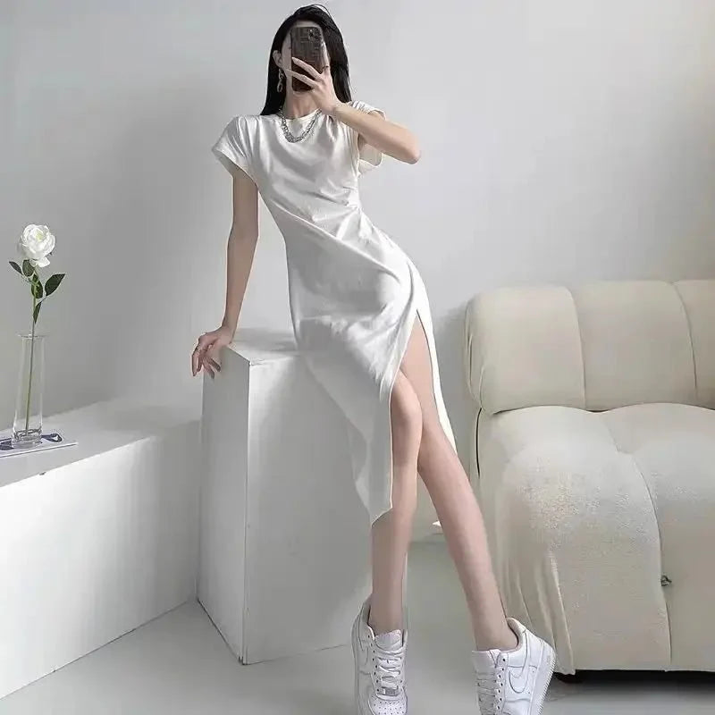 Y2K asymmetrical hem midi dress by The Glow Sanctuary, showcasing a stylish streetwear look with modern, edgy design.