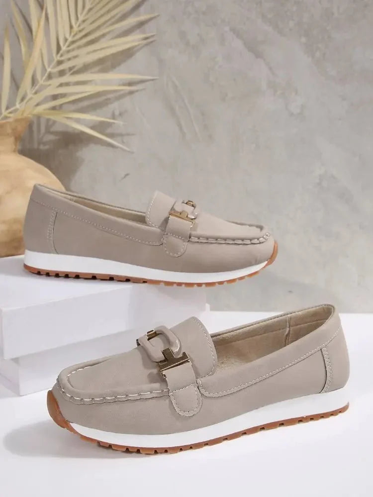 Women's slip-on flat shoes with buckle detail from TrendLux Wear, featuring a comfortable, stylish design for everyday wear.