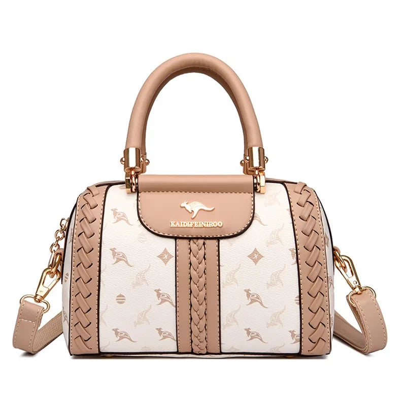 Luxury handbag in beige and white, featuring animal prints and braided detailing; includes an adjustable strap.