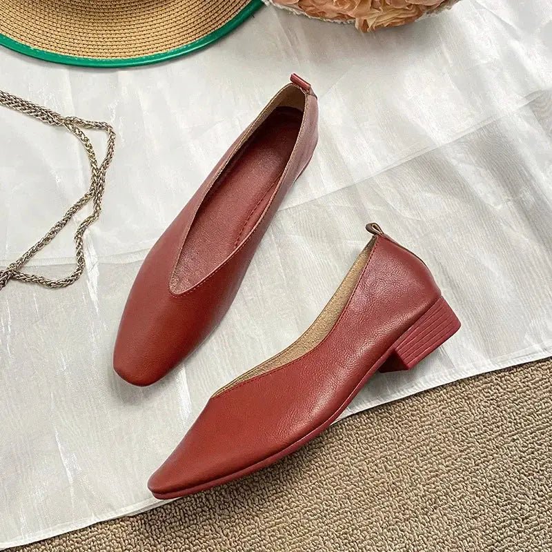 Women's round-toe leather loafer flats by TrendLux Wear, showing a stylish black leather shoe with a sleek finish.