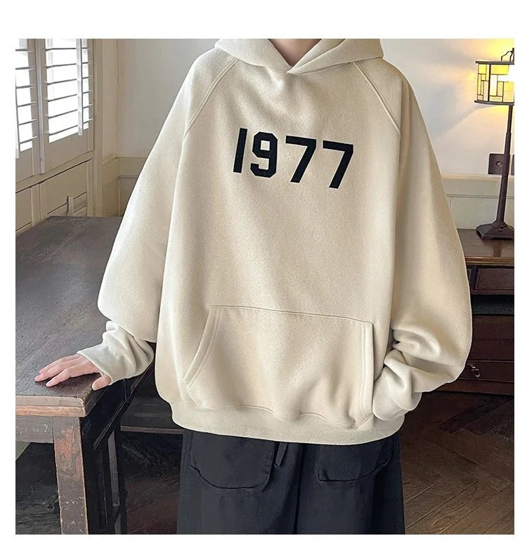 Men's TrendLux Wear 1977 printed Harajuku hoodie with loose fit long sleeves and bold retro graphic design.