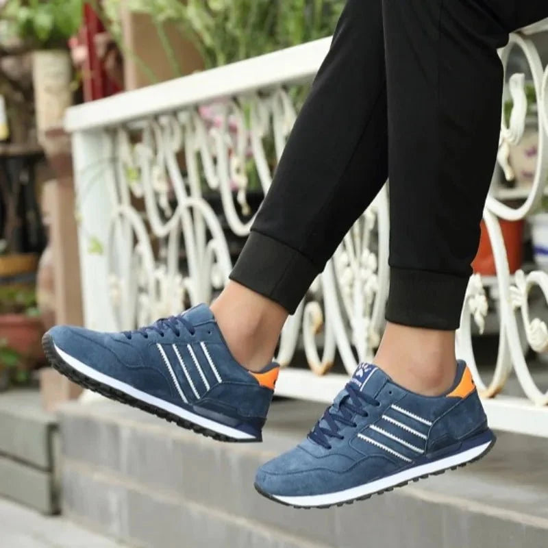 Men's luxury suede running sneakers by TrendLux Wear with breathable, anti-odor sport shoes design, shown in a sleek side view.