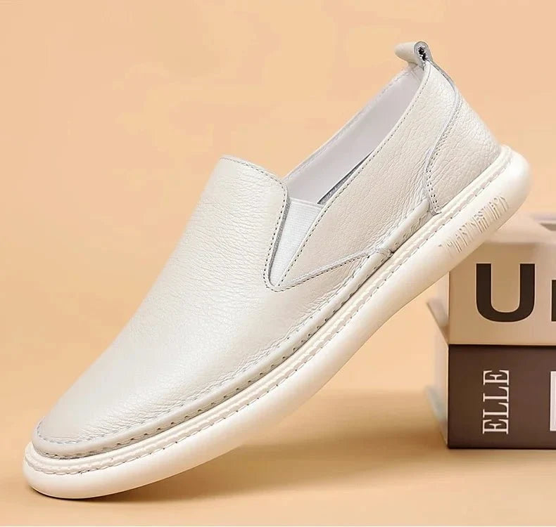 Men's genuine leather casual loafers by TrendLux Wear, breathable slip-on flat shoes in solid color with stylish design.
