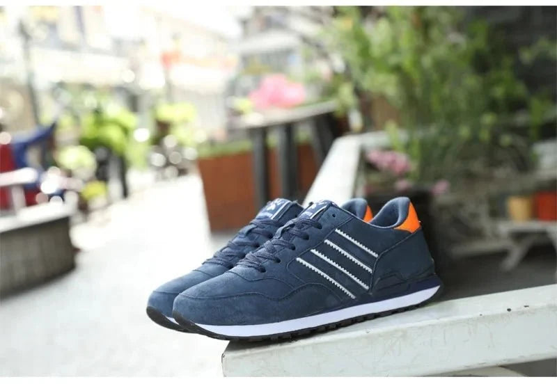Men's luxury suede running sneakers by TrendLux Wear featuring breathable design and anti-odor sport shoes for active wear.