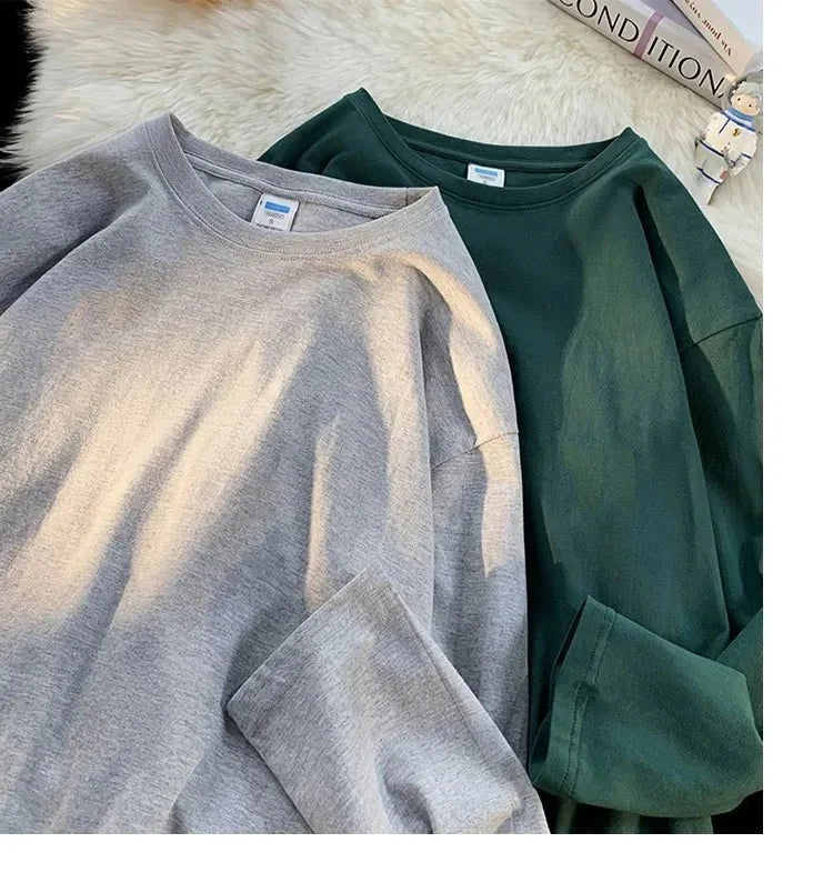 Unisex oversized long sleeve blank T-shirt by My Store 5 in black, shown flat with long sleeves and a relaxed fit.